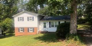 Travelers Rest !! 3 BR, 2 BA with Great Living Space - Den, Bonus Room, Primary Suite has a HUGE walk in Closet, Laundry Room, private screened in porch  deck AND a storage shed out back. Fresh Paint and New LVP Floors Gallery 1