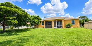 JFK 3 bedroom 2 Bath with oversized  Lanai and  large  backyard.  2 car garage Gallery 1