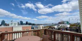 ** Half off First Month** Charming 2BD/2BA Townhome w/ Roof Deck in Riverside, MD! Gallery 1