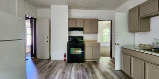 Spacious 5 Bedroom 2 Full Bath House | Front Porch | Back Yard | Off Street Parking | in-Unit Laundry Hookups Gallery 1