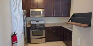 Beautiful 2nd floor (with elevator services) condominium: 2-bed, 2-bath, beautiful kitchen, bonus room, laundry room & deck! Gallery 8