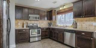 {5611} Updated OP Ranch + Two Car Garage + Fenced Yard and Stamped Concrete Patio Perfect for Spring BBQs Gallery 15