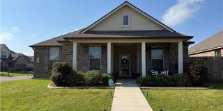 Welcome home to this **beautiful 4-bedroom, 2-bath rental Gallery 1