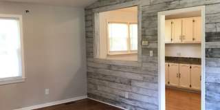 Travelers Rest !! 3 BR, 2 BA with Great Living Space - Den, Bonus Room, Primary Suite has a HUGE walk in Closet, Laundry Room, private screened in porch & deck AND a storage shed out back.  Fresh Paint and New LVP Floors Gallery 5