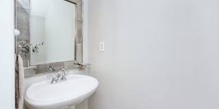 Discover this beautifully updated Raintree townhome featuring an open floor plan and a range of contemporary enhancements. Gallery 15