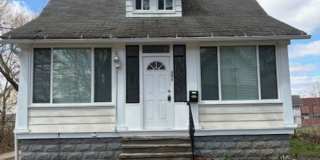 Cozy 2-Bed Single-Family in East Akron — Pet-Friendly, Garage + Covered Patio Gallery 1