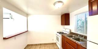 Studios and 1 bedrooms that include all utilities! Off Street Parking and Tile Flooring! Gallery 15