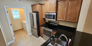 50% off this beautiful 2/2 Bouchelle Condo with private garage, see details* Gallery 1