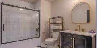 Completely remodeled like new Gingerbread midtown cottage with gleaming hardwoods, converted from a 3/1 to a 3/2. Gallery 28