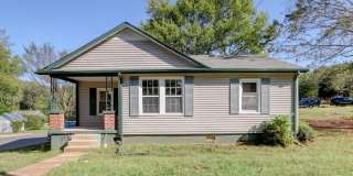 Charming Renovated Ranch Style Home With Hardwood Flooring and White Cabinetry Gallery 1