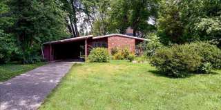 Enjoy the ease of one-level living in this charming rustic contemporary home, tucked away among mature trees in the highly desirable Holmes Run Acres community. Gallery 1