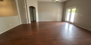 Single-level 3-bedroom home in a desirable Chandler location featuring a 2-car garage and tile roof and wood plank flooring throughout Gallery 19