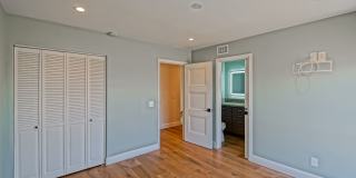Remodeled, Bright & Airy End Unit Condo Overlooking Randall Preserve w/ Grand Entry Foyer, Open & Bright 2-Tiered Living Space, 3 Balconies & Oversized 2-Car Garage + Multi-Car Driveway in Newport Crest Community! Gallery 32