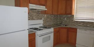 3-Bedroom Brick Rowhome with Hardwood Floors in East Mayfair Gallery 1