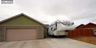 Centrally-located 3 bedroom home with paved RV parking. Gallery 1