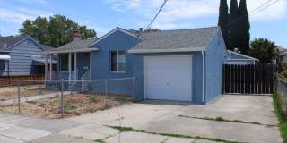 Ready for Move In! Three Bedroom, 1 1/2 Bathroom House with 2 Garages and Side Yard Access in Pittsburg Gallery 1