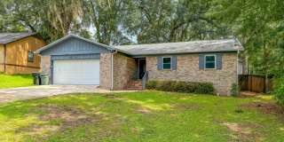 LOVELY NE 3/2 w/ Granite Counters, Stainless Steel Appliances, Plank Vinyl Floors, Garage, & Large Fenced Yard Avail NOW for $2100/month! Gallery 1