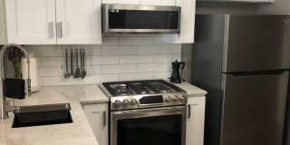 ONE MONTH FREE! Luxury 2 Bed 1 Bath Condo w/ ATTACHED GARAGE Gallery 5