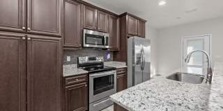 Welcome home to this beautifully maintained townhome in Mossy Oak Village. Gallery 11