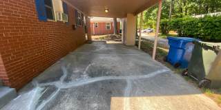 Private carport, in-unit laundry, and the Lakewood strip right outside your door. Gallery 14