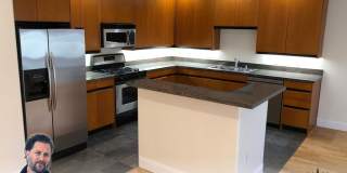 OPEN TOMORROW! Huge bi-level 3 bedroom 2.5 bath loft style apartment w/huge sunny yard, gas fireplace, remodeled kitchen, in-unit laundry and garage parking Gallery 1