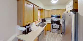 2 BR, 1.5 BA Clive split level duplex.  Deck and one car attached garage. Gallery 14