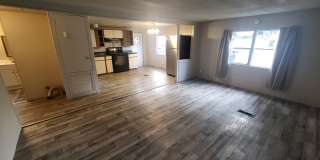 Freshly painted spacious 2-bedroom 1-bath home with a screened porch and storage shed. Gallery 1