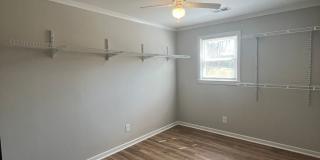 Travelers Rest !! 3 BR, 2 BA with Great Living Space - Den, Bonus Room, Primary Suite has a HUGE walk in Closet, Laundry Room, private screened in porch & deck AND a storage shed out back.  Fresh Paint and New LVP Floors Gallery 18