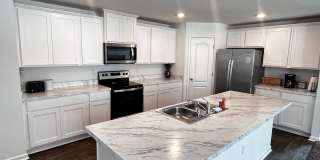 Picturesque Waterfront 4-Bedroom Home with Premium Amenities + 3 Car Garage! Community Amenities! Gallery 7