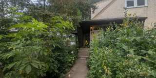Charming Garden Oasis in West St. Paul – Fire Pit, Pond & Prime Location! Gallery 1