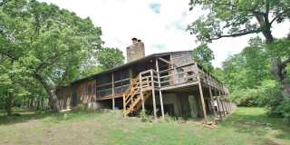 Secluded luxury cabin in woods with private lake! Great Central location between Topeka & Lawrence! - Beware of FRAUD! Deposits are handled in person and ONLY at our office. Gallery 1