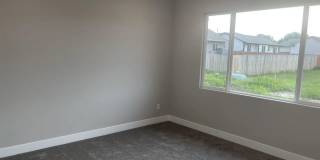 Single family slab home with three car garage. This home is 4 bedrooms, three bathrooms open floor plan. Zero entry home. Mowing included. Gallery 6