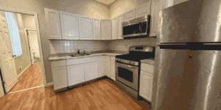 Charming 4BR/2BA Rowhouse with Hardwood-Style Flooring Throughout Gallery 17