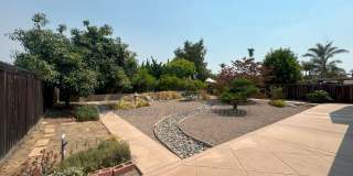 Welcoming Single-Level Home in a Great Neighborhood! With gorgeous landscaping and plentiful fruit trees. Gallery 1