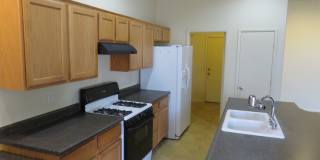 Huge family room with kitchen nicely tucked in the middle. Gallery 5