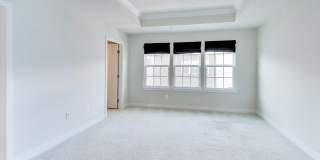 Welcome to this beautifully designed 3 level townhome in Westphalia Town Center Community! Gallery 15