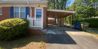 Private carport, in-unit laundry, and the Lakewood strip right outside your door. Gallery 1