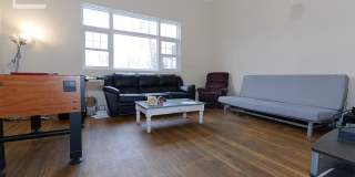 Huge Townhouse near T w Laundry in Unit!  30 Foot Ceilings in Living Room! Gallery 3