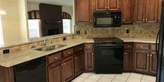 Beautiful granite and tile backsplash to update the large kitchen. 3 bedrooms + an office, large master, corner lot! Gallery 1