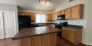 Single-level 3-bedroom home in a desirable Chandler location featuring a 2-car garage and tile roof and wood plank flooring throughout Gallery 13