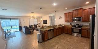 Stunning 8-Bedroom Champions Gate Pool Home  | Cable, Internet & Pool Care Included Gallery 3