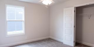 Modern Living Redefined with Stone Fireplace, Gray Cabinetry, Spa Inspired Primary Suite and Covered Outdoor Retreat Gallery 18