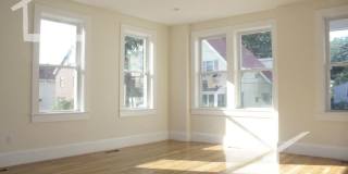 Nicely renovated Townhouse in a prime location near the Green Line with parking included! Gallery 21