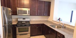 Beautiful 2nd floor (with elevator services) condominium: 2-bed, 2-bath, beautiful kitchen, bonus room, laundry room & deck! Gallery 9