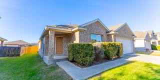 Charming Brick Home with Open Floorplan, Vaulted Ceilings, and Luxurious Amenities—Perfect for Any Lifestyle! Gallery 1