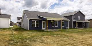 Modern Living Redefined with Stone Fireplace, Gray Cabinetry, Spa Inspired Primary Suite and Covered Outdoor Retreat Gallery 19