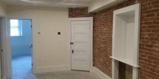 Nicely updated ground level 1 bed with in-unit laundry near the Green Line. Gallery 4