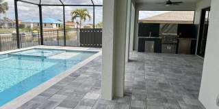 Brand-New Waterfront Luxury in Cape Coral | Heated Pool, Spa, Outdoor Kitchen & 3-Car Garage Gallery 37
