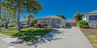 Bright & Charming, Single Story 3BR2BA Home w/ Large Front Yard, Huge Fenced Rear Yard w/ Large Driveway/Patio, Lawn Area & Dectached 2-Car Garage Close to Shopping, Freeway Access & 5 Minutes To Beach! Bright & Charming, Single Story 3BR2BA Home w/ Large Front Yard, Huge Fenced Rear Yard w/ Large Driveway/Patio, Lawn Area & Dectached 2-Car Garage Close to Shopping, Freeway Access & 5 Minutes To Beach! Gallery 1