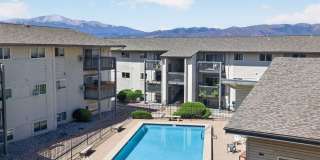 Welcome Home to Your Remodeled 2BD Top-Floor Condo w/ Pikes Peak Views – Utilities Included Gallery 1